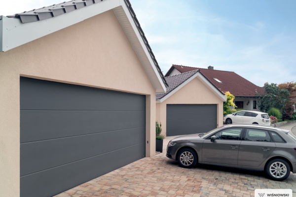 Comment installer une porte de garage sectionnelle ?